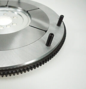Flywheel segmented inserts and mounting studs